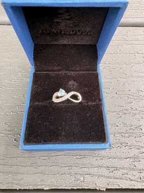 Silver Infinity Ring with Blue Gemstone Accent